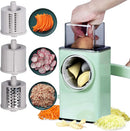 Multifunctional vegetable chopper with different attachments and sliced vegetables on a white background
