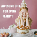 A young girl wearing a party hat smiles while covering her eyes, with large candles on a cake in front of her. White text on the left reads 'AWESOME GIFT FOR EVERY FAMILY!!'.